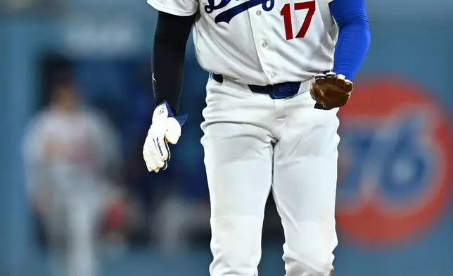 Los Angeles Dodgers' Shohei Ohtani gestures after stealing second base during the second inning of a baseball game against the St. Louis Cardinals, Wednesday, Sept. 2, 2026, in Los Angeles. (AP Photo/William Liang)