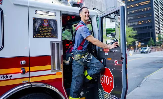 Lt. Anthony Giannone of Ladder 10 FDNY work near Ground Zero, 25 years after the Sept. 11, 2001, attacks, on Friday, Aug. 7, 2026 in New York. (AP Photo/Angelina Katsanis)