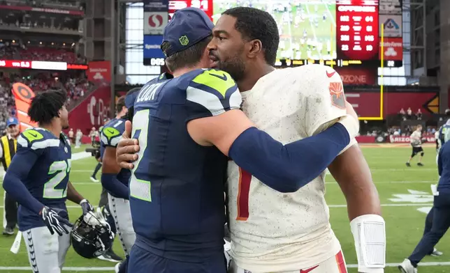 Seattle Seahawks quarterback Drew Lock (2) greets Arizona Cardinals quarterback Jacoby Brissett (7) after the Seahawks won an NFL football game in Glendale, Ariz., Sunday, Sept. 20, 2026. (AP Photo/Rick Scuteri)