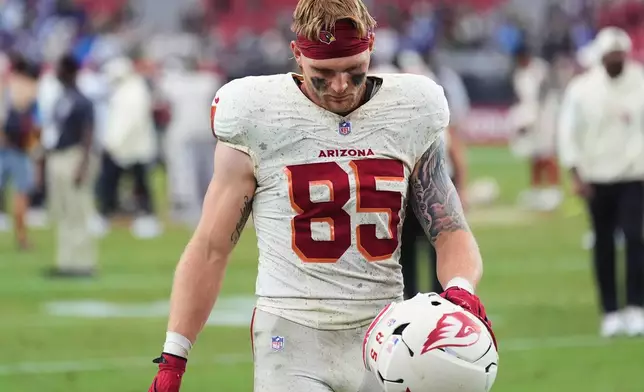 Arizona Cardinals tight end Trey McBride walks off the field after a loss to the Seattle Seahawks in an NFL football game in Glendale, Ariz., Sunday, Sept. 20, 2026. (AP Photo/Ross D. Franklin)