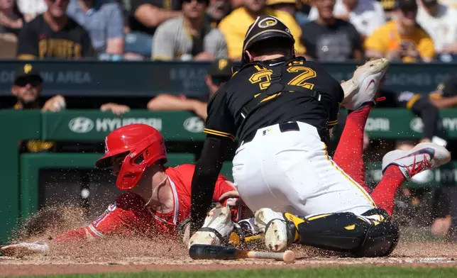 Pittsburgh Pirates catcher Henry Davis, right, tags out Los Angeles Angels' Zach Neto, left, who was trying to score during the fifth inning of a baseball game in Pittsburgh, Sunday, Sept. 6, 2026. (AP Photo/Tom E. Puskar)