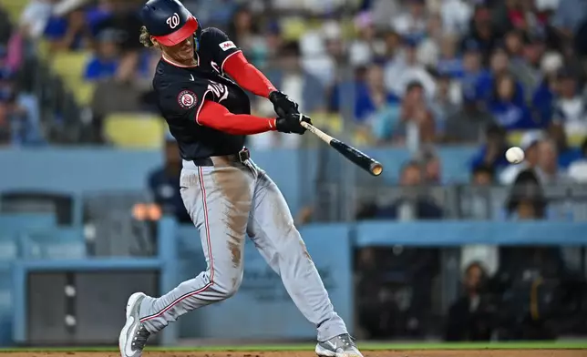 Washington Nationals' Brady House hits a single during the second inning of a baseball game against the Los Angeles Dodgers, Friday, Sept. 4, 2026, in Los Angeles. (AP Photo/William Liang)