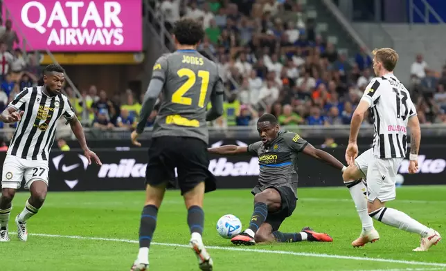 Inter Milan's Ange-Yoan Bonny shoots to score his sides fifth goal during the Serie A soccer match between Inter Milan and Udinese in Milan, Italy, Monday, Sept. 14, 2026. (AP Photo/Antonio Calanni)
