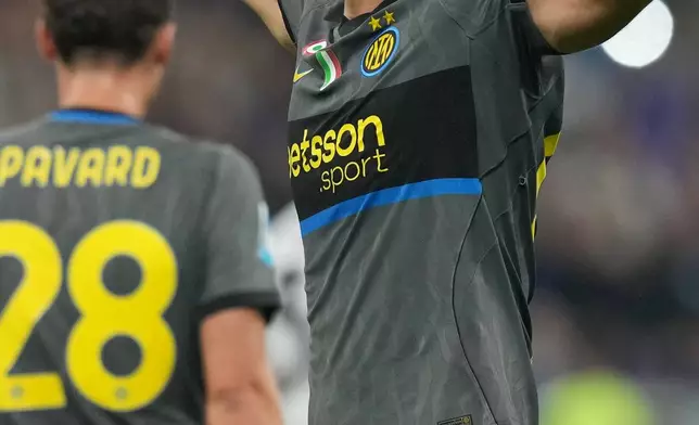 Inter Milan's Francesco Pio Esposito celebrates after scoring his sides fourth goal during the Serie A soccer match between Inter Milan and Udinese in Milan, Italy, Monday, Sept. 14, 2026. (AP Photo/Antonio Calanni)