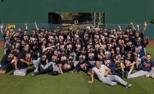 Houston Astros pose for a photo after clinching the AL West division title in a baseball game against the Athletics, Sunday, Sept. 27, 2026, in West Sacramento, Calif. (AP Photo/Sara Nevis)