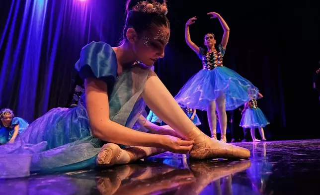 Students from the Baghdad Ballet Academy prepare to perform in a production titled "Mermaid" at Al-Sinbad Theater in Baghdad, Iraq, Friday, Sept. 25, 2026. (AP Photo/Hadi Mizban)