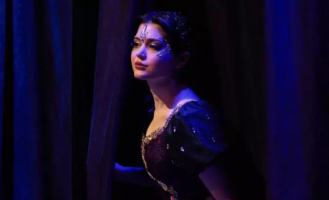 A Baghdad Ballet Academy student waits in the wings to perform in a production titled "Mermaid" at Al-Sinbad Theater in Baghdad, Iraq, Friday, Sept. 25, 2026. (AP Photo/Hadi Mizban)