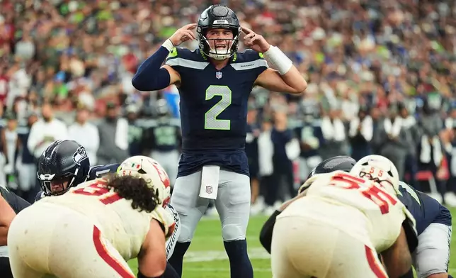 Seattle Seahawks quarterback Drew Lock (2) prepares for a snap against the Arizona Cardinals during the first half of an NFL football game in Glendale, Ariz., Sunday, Sept. 20, 2026. (AP Photo/Ross D. Franklin)
