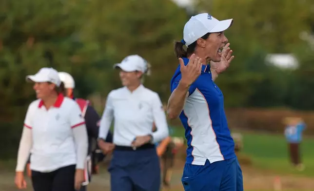 Carlota Ciganda of Europe reacts after holing a putt on the 18th green during the Solheim Cup in Den Bosch, Netherlands, Friday, Sept. 11, 2026. (AP Photo/Alastair Grant)