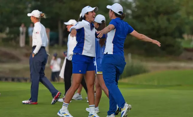 Carlota Ciganda, right, and Julia López Ramírez of Europe react after holing a putt on the 18th green during the Solheim Cup in Den Bosch, Netherlands, Friday, Sept. 11, 2026. (AP Photo/Alastair Grant)