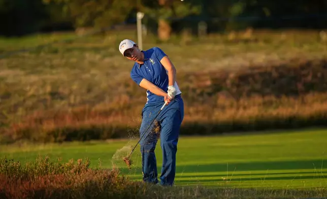 Carlota Ciganda of Europe chips onto the 18th green during the Solheim Cup in Den Bosch, Netherlands, Friday, Sept. 11, 2026. (AP Photo/Alastair Grant)