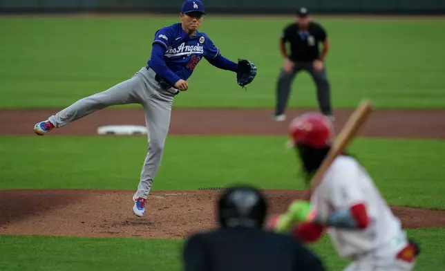 Los Angeles Dodgers pitcher Yoshinobu Yamamoto throws during the first inning of a baseball game against the Cincinnati Reds, Tuesday, Sept. 15, 2026, in Cincinnati. (AP Photo/Carolyn Kaster)