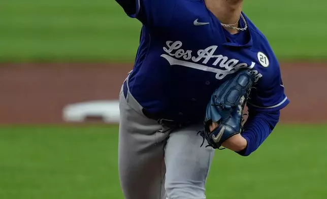 Los Angeles Dodgers pitcher Yoshinobu Yamamoto throws during the first inning of a baseball game against the Cincinnati Reds, Tuesday, Sept. 15, 2026, in Cincinnati. (AP Photo/Carolyn Kaster)