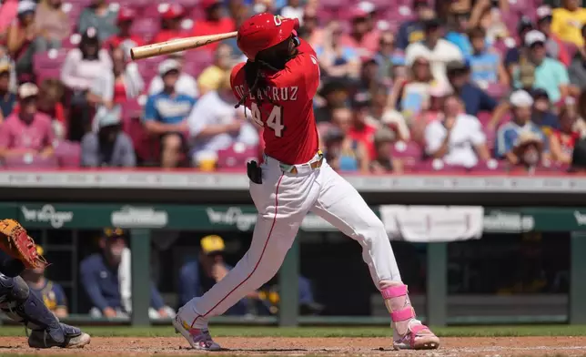 Cincinnati Reds' Elly De La Cruz follows through after hitting a two-run home run in the fourth inning of a baseball game against the Milwaukee Brewers, Sunday, Sept. 6, 2026, in Cincinnati. (AP Photo/Kareem Elgazzar)