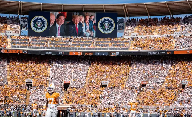 President Donald Trump is displayed on the scoreboard as he attends the Tennessee-Texas NCAA college football game in Knoxville, Tenn., Saturday, Sept. 26, 2026. (Sara Diggins/The San Antonio Express-News via AP)