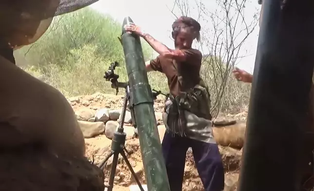 This image taken from undated video released by the Ansar Allah Media Office, the media arm of Yemen's Houthi rebels, on Tuesday, Sept. 22, 2026, shows what the group says is a Houthi fighter firing a mortar during clashes with Saudi-backed forces at an undisclosed location in Yemen. (Ansar Allah Media Office via AP)