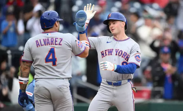 New York Mets' A.J. Ewing, right, celebrates his three-run home run with Francisco Alvarez (4) during the seventh inning of a baseball game against the Washington Nationals, Saturday, Sept. 26, 2026, in Washington. (AP Photo/Nick Wass)
