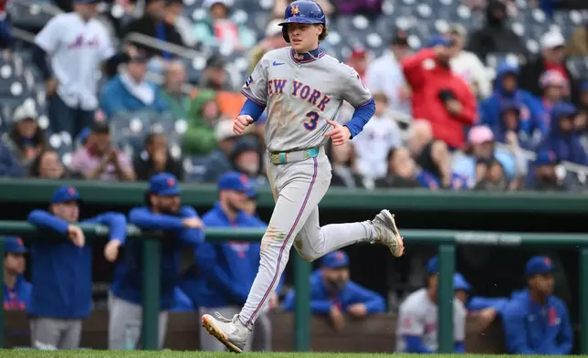 New York Mets' Carson Benge scores a run during the eighth inning of a baseball game against the Washington Nationals, Saturday, Sept. 26, 2026, in Washington. (AP Photo/Nick Wass)