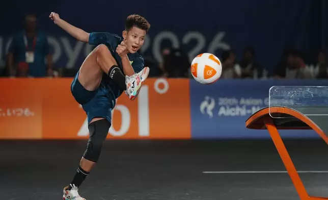 Myanmar's Khin Hnin Wai plays a return against Indonesia's Sumaya during their women's singles teqball final match at the Asian Games in Nagoya, Japan, Sunday, Sept. 20, 2026. (AP Photo/Lee Jin-man)