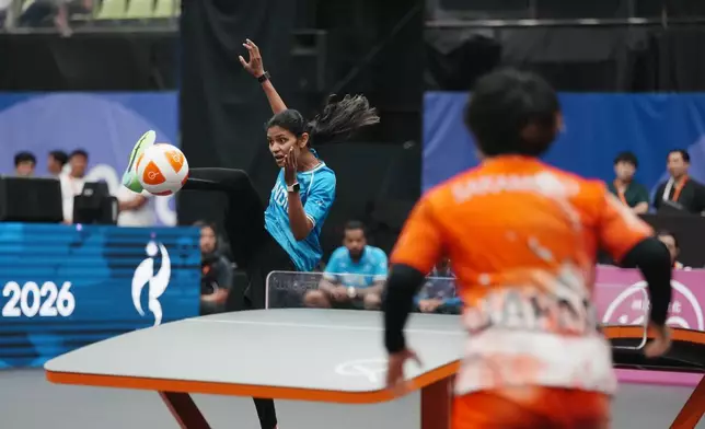 India's Quimcy Joaquim Dsouza controls the ball during the women's singles bronze-medal teqball match against Japan's Yuina Sakamoto at the 20th Asian Games in Nagoya, Japan, Sunday, Sept. 20, 2026. (AP Photo/Lee Jin-man)