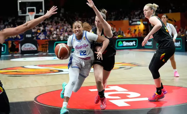 Belgium's Antonia Delaere guards Puerto Rico's Arella Guirantes during the Women's Basketball World Cup match between Puerto Rico and Belgium in Berlin, Sunday, Sept. 6, 2026. (AP Photo/Ebrahim Noroozi)