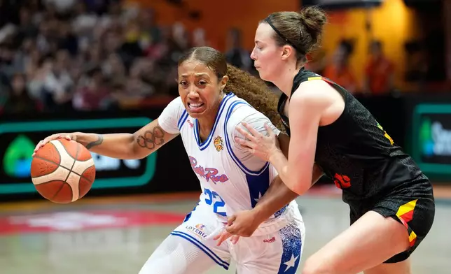 Belgium's Antonia Delaere guards Puerto Rico's Arella Guirantes during the Women's Basketball World Cup match between Puerto Rico and Belgium in Berlin, Sunday, Sept. 6, 2026. (AP Photo/Ebrahim Noroozi)