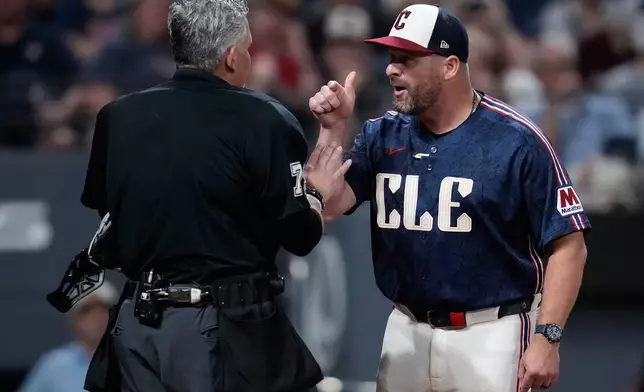 Cleveland Guardians manager Stephen Vogt, right, continues to argue with home plate umpire Manny Gonzalez, left, after being ejected from the game in the fifth inning of the second baseball game of a split doubleheader against the Detroit Tigers in Cleveland, Friday, Sept. 4, 2026. (AP Photo/Sue Ogrocki)