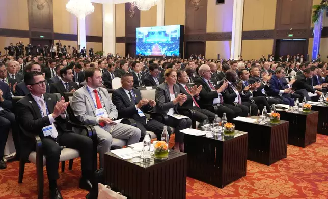 Delegates applaud during the opening an international conference on combating online scams in Phnom Penh, Cambodia, Wednesday, Sept. 23, 2026. (AP Photo/Heng Sinith)