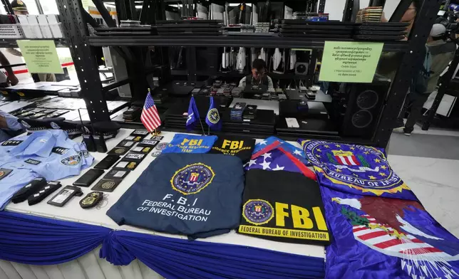 Evidentiary materials are displayed at the Phnom Penh Municipal Police headquarter following an operation against scam centers in Phnom Penh, Cambodia, Tuesday, Sept. 22, 2026. (AP Photo/Heng Sinith)
