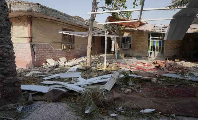 Debris is scattered across the courtyard of a building that Iranian media said was hit by a U.S. strike while a wedding celebration was taking place there, in Kuhestak, southern Iran, Wednesday, Sept. 2, 2026. (Morteza Akhoondi/Tasnim News Agency via AP)