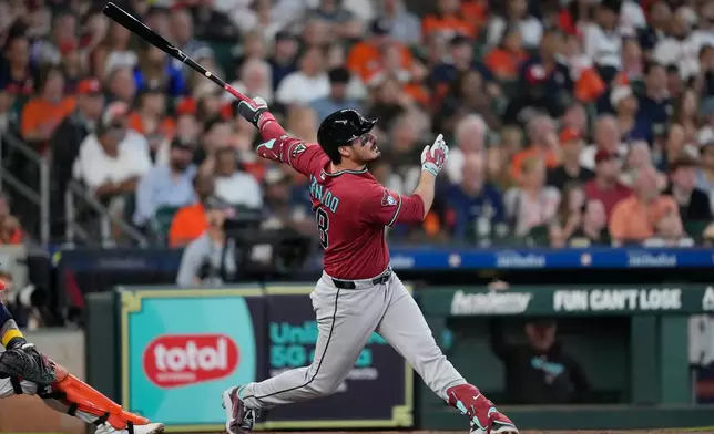 Arizona Diamondbacks' Nolan Arenado hits a two-run home run against the Houston Astros during the third inning of a baseball game Sunday, Sept. 6, 2026, in Houston. (AP Photo/David J. Phillip)