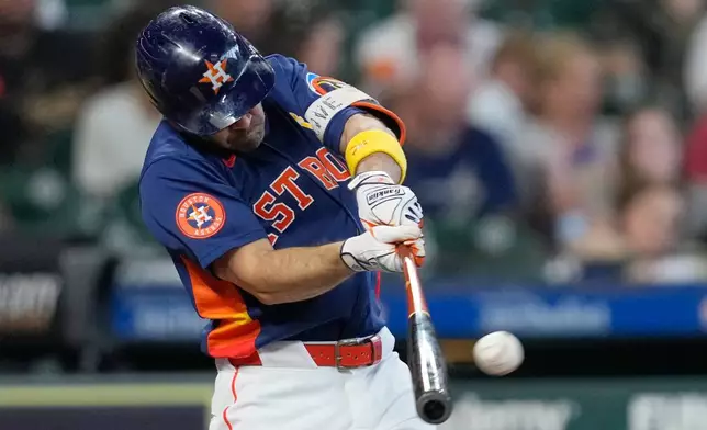 Houston Astros' Jose Altuve hits a single against the Arizona Diamondbacks during the sixth inning of a baseball game Sunday, Sept. 6, 2026, in Houston. (AP Photo/David J. Phillip)