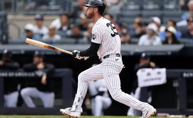 New York Yankees left fielder Cody Bellinger watches his two-run home run in the fourth inning during the first baseball game of a doubleheader against the Tampa Bay Rays, Tuesday, Sept. 22, 2026, in New York. (AP Photo/Adam Hunger)