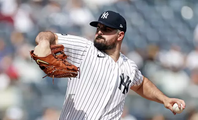 New York Yankees pitcher Carlos Rodon throws in the first inning during the first baseball game of a doubleheader against the Tampa Bay Rays, Tuesday, Sept. 22, 2026, in New York. (AP Photo/Adam Hunger)