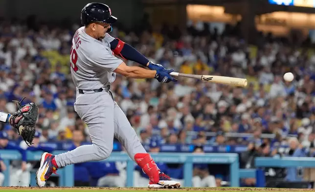 St. Louis Cardinals' Ramón Urías hits a RBI single during the third inning of a baseball game against the Los Angeles Dodgers, Thursday, Sept. 3, 2026, in Los Angeles. (AP Photo/Mark J. Terrill)