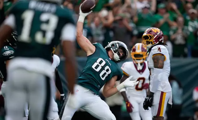 Philadelphia Eagles tight end Dallas Goedert (88) celebrates his touchdown catch against the Washington Commanders during the first half of an NFL football game, Sunday, Sept. 13, 2026, in Philadelphia. (AP Photo/Matt Slocum)