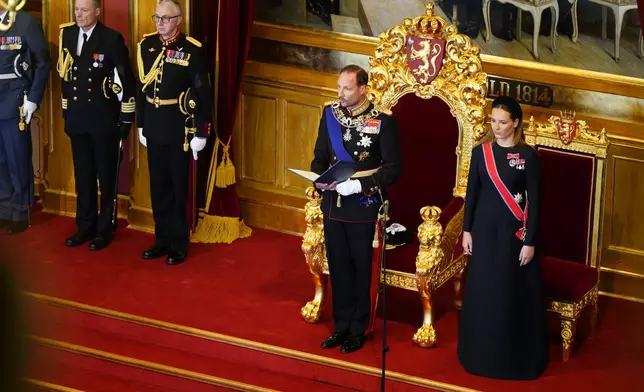 King Haakon VIII., left, takes the oath according to the Constitution in the Storting, Norway's parliament, accompanied by Crown Princess Ingrid Alexandra, right, in Oslo, Norway, Tuesday, Sept. 1, 2026. (Hakon Mosvold Larsen/Pool Photo via AP)