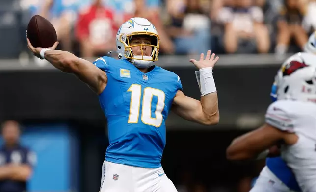 Los Angeles Chargers quarterback Justin Herbert (10) passes against the Arizona Cardinals during the first half of an NFL football game, Sunday, Sept. 13, 2026, in Inglewood, Calif. (AP Photo/Caroline Brehman)