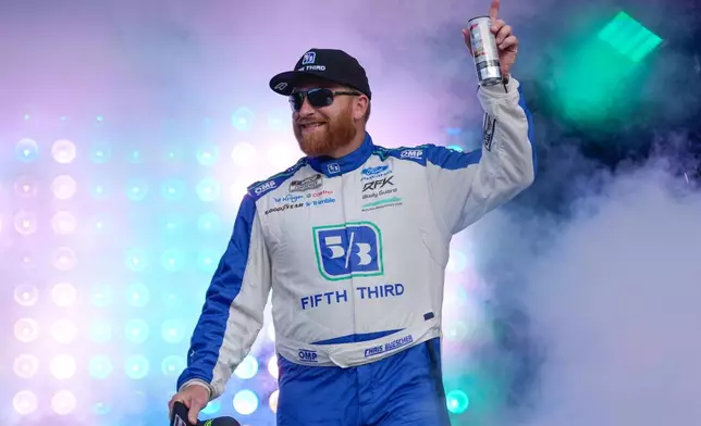 Chris Buescher waves to fans during driver introductions before a NASCAR Cup Series auto race at Daytona International Speedway, Saturday, Aug. 29, 2026, in Daytona Beach, Fla. (AP Photo/John Raoux)