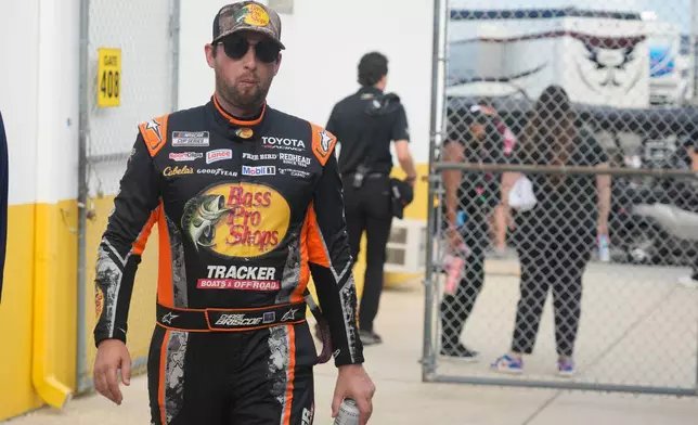 Chase Briscoe walks to the drivers meeting before a NASCAR Cup Series auto race at Daytona International Speedway, Saturday, Aug. 29, 2026, in Daytona Beach, Fla. (AP Photo/John Raoux)