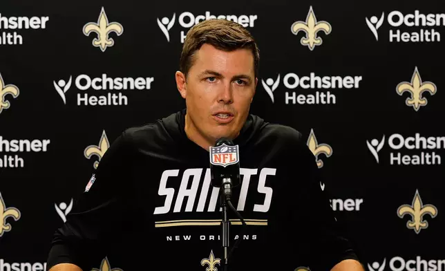 New Orleans Saints head coach Kellen Moore talks to reporters after an NFL football game against the Detroit Lions, Sunday, Sept. 13, 2026, in Detroit. (AP Photo/Rey Del Rio)