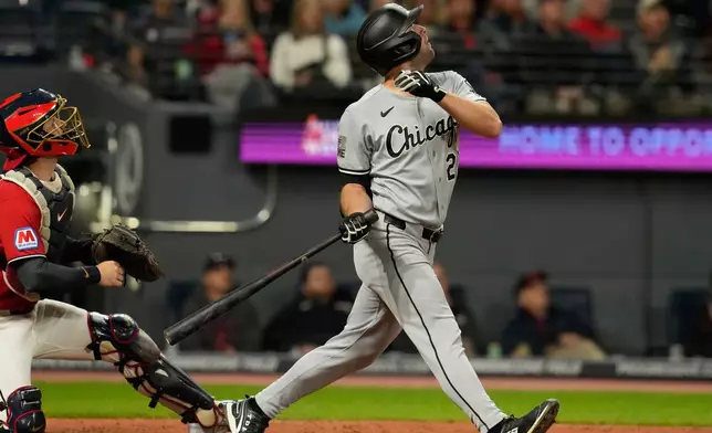 Chicago White Sox's Tristan Peters, right, and Cleveland Guardians catcher Patrick Bailey, left, watch a foul ball hit by Peters in the sixth inning of a baseball game in Cleveland, Monday, Sept. 14, 2026. (AP Photo/Sue Ogrocki)