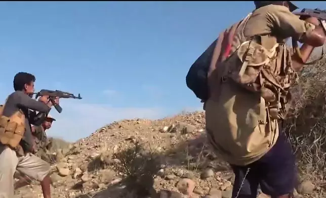 This image taken from undated video released by the Ansar Allah Media Office, the media arm of Yemen's Houthi rebels, on Tuesday, Sept. 22, 2026, shows, according to the group, Houthi fighters firing rifles during clashes with Saudi-backed forces at an undisclosed location in Yemen. (Ansar Allah Media Office via AP)