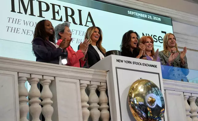 First lady Melania Trump, third from left, rings the opening bell at the New York Stock Exchange Wednesday, Sept. 23, 2026, in New York. (AP Photo/Seth Wenig)