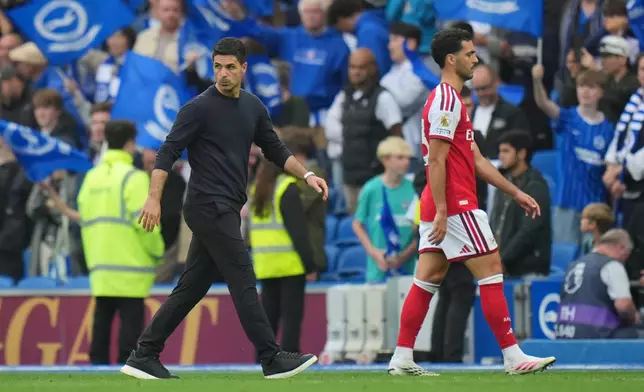 Arsenal's manager Mikel Arteta walks off the pitch after the English Premier League soccer match between Brighton & Hove Albion and Arsenal in Brighton, England, Saturday, Sept. 19, 2026. (AP Photo/Kin Cheung)