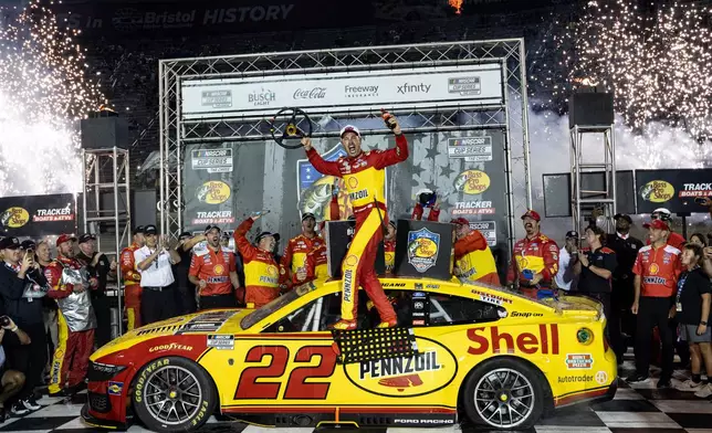 Joey Logano (22) celebrates after winning a NASCAR Cup Series auto race Saturday, Sept. 19, 2026, in Bristol, Tenn. (AP Photo/Wade Payne)