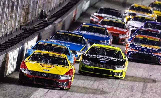 Joey Logano (22) leads Austin Cindric (2) and Alex Bowman during a NASCAR Cup Series auto race Saturday, Sept. 19, 2026, in Bristol, Tenn. (AP Photo/Wade Payne)