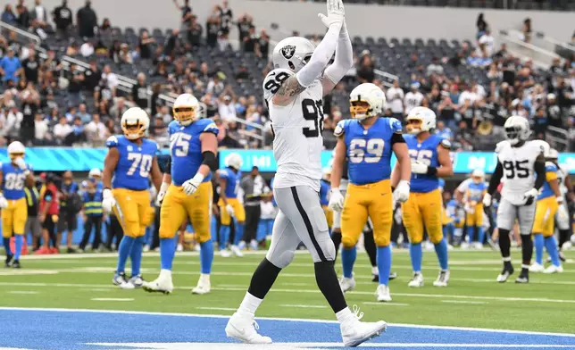 Las Vegas Raiders defensive end Maxx Crosby (98) celebrates after a win over the Los Angeles Chargers in an NFL football game in Inglewood, Calif., Sunday, Sept. 20, 2026. (AP Photo/Katie Chin)