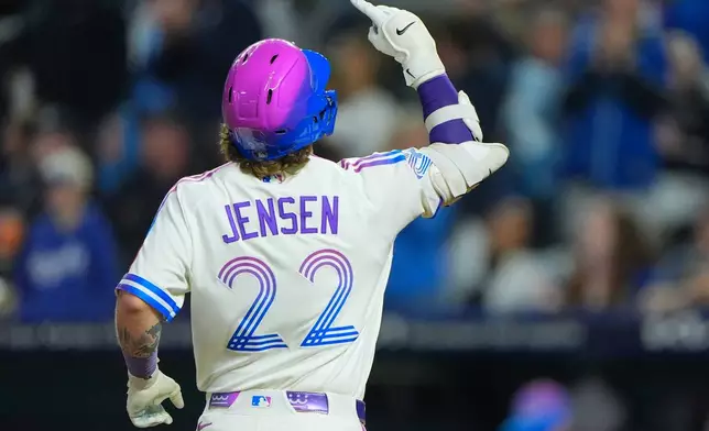 Kansas City Royals' Carter Jensen celebrates as he runs home after hitting a two-run home run during the eighth inning of a baseball game against the Cleveland Guardians, Friday, Sept. 25, 2026, in Kansas City, Mo. (AP Photo/Charlie Riedel)