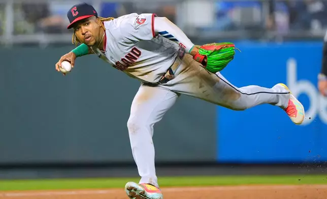 Cleveland Guardians third baseman Jose Ramirez looks to throw on after fielding a single hit by Kansas City Royals' Maikel Garcia during the fourth inning of a baseball game, Friday, Sept. 25, 2026, in Kansas City, Mo. (AP Photo/Charlie Riedel)